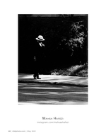 man in a straw hat street photography