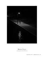 lone figure under streetlight street photography